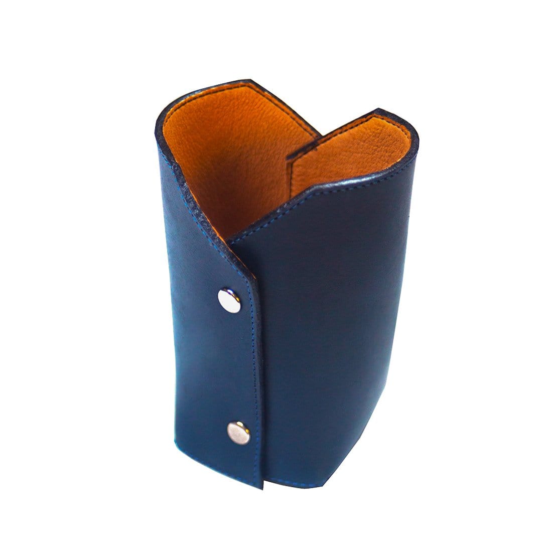 Handcrafted navy leather pencil cup with warm orange lining and metallic snap details