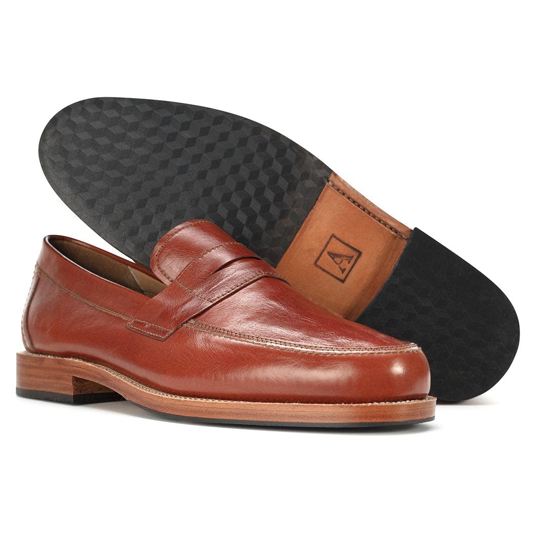 Men's 2E-wide brown leather penny loafer, shown with the sole turned up, made to order in size 16 – The Luca