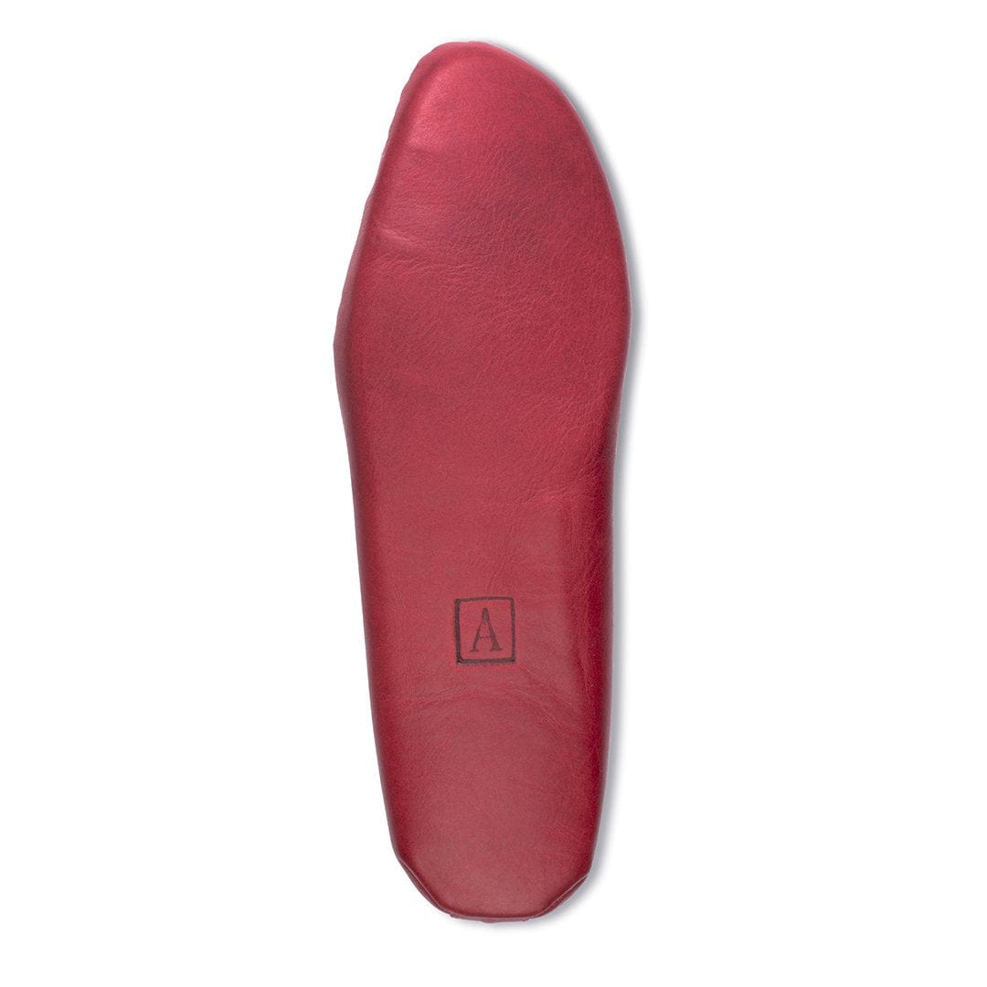 Men's 4E-wide red leather moccasin, showing the leather sole. For feet that are hard to fit