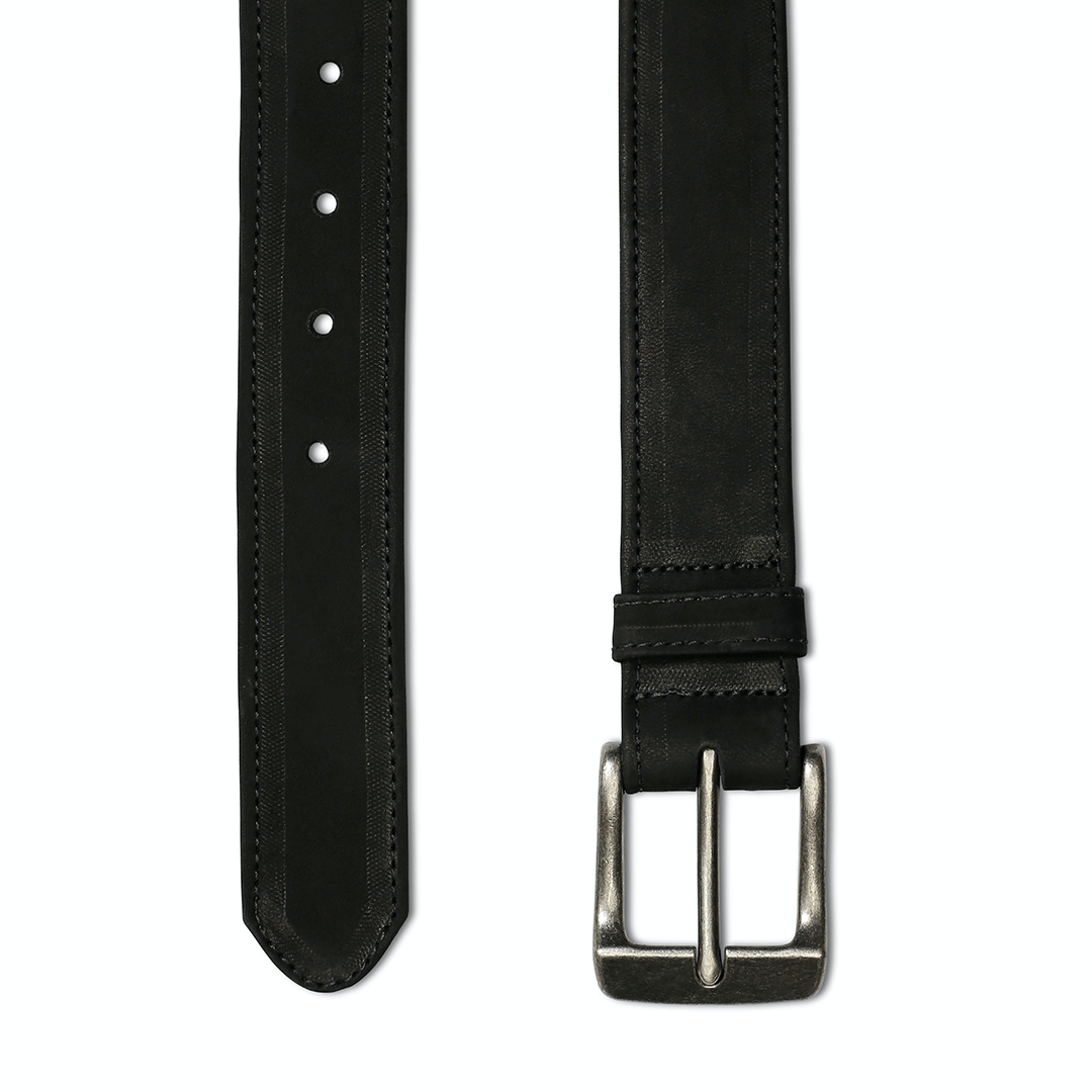 Black leather belt, laid out full length, made by hand by our artisans