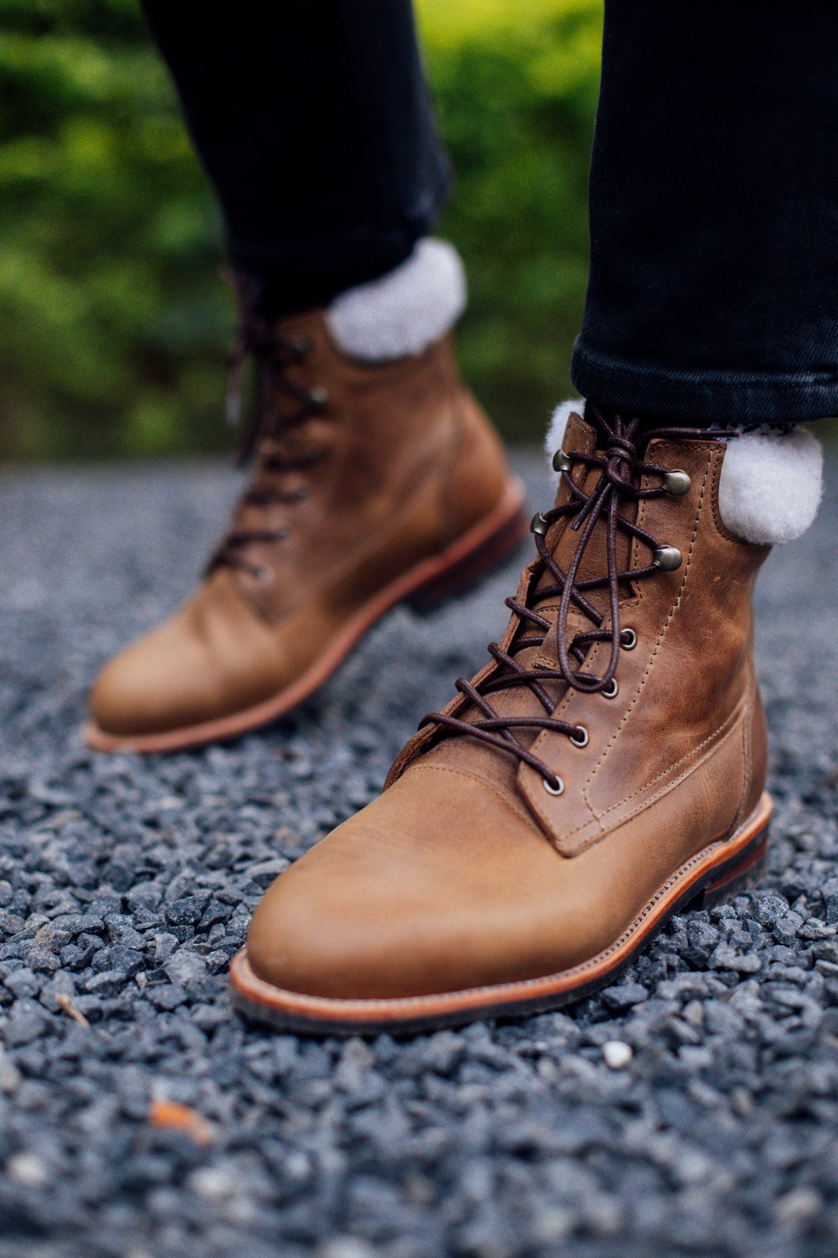 Women's narrow A-width shearling-lined light brown leather winter boots, worn on foot. Handcrafted to order in Guatemala
