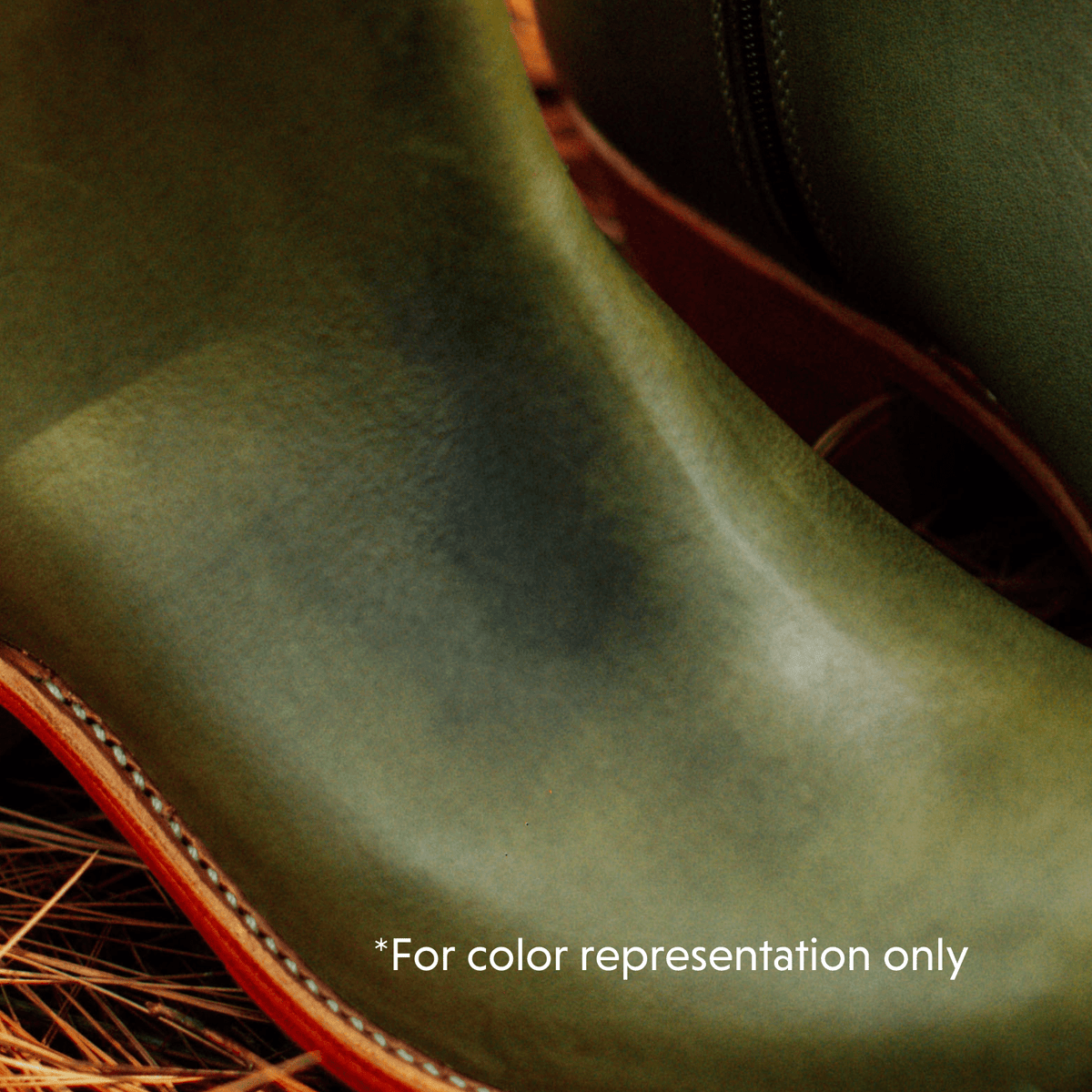 Women's green Chelsea boot close-up with contrast stitching and handcrafted construction