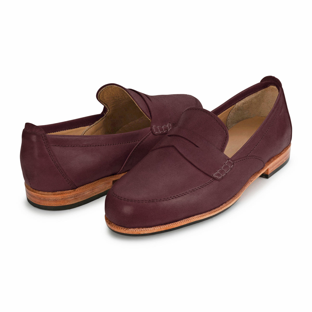 Pair of women's EE wide burgundy leather dress loafers, angled from the front, with split sizing for two different-sized feet