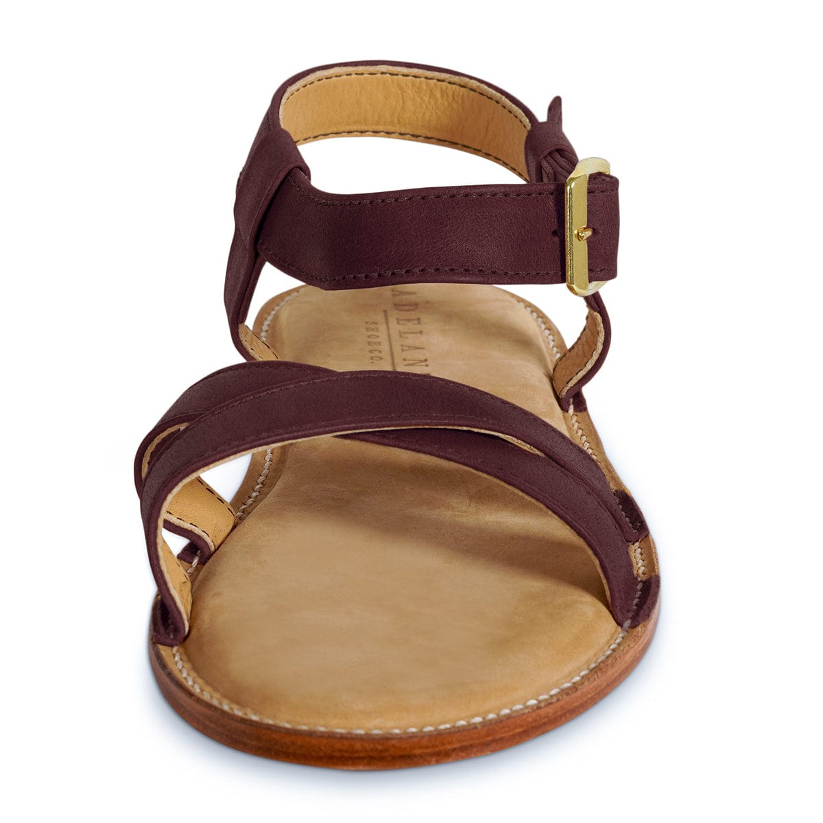 Burgundy leather women's sandal with adjustable ankle strap, gold buckle, cushioned footbed, and handcrafted construction by Adelante