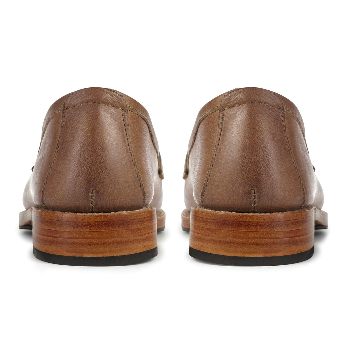 Rear view of brown leather women's penny loafers with stacked heels and black rubber soles by Adelante Made-To-Order
