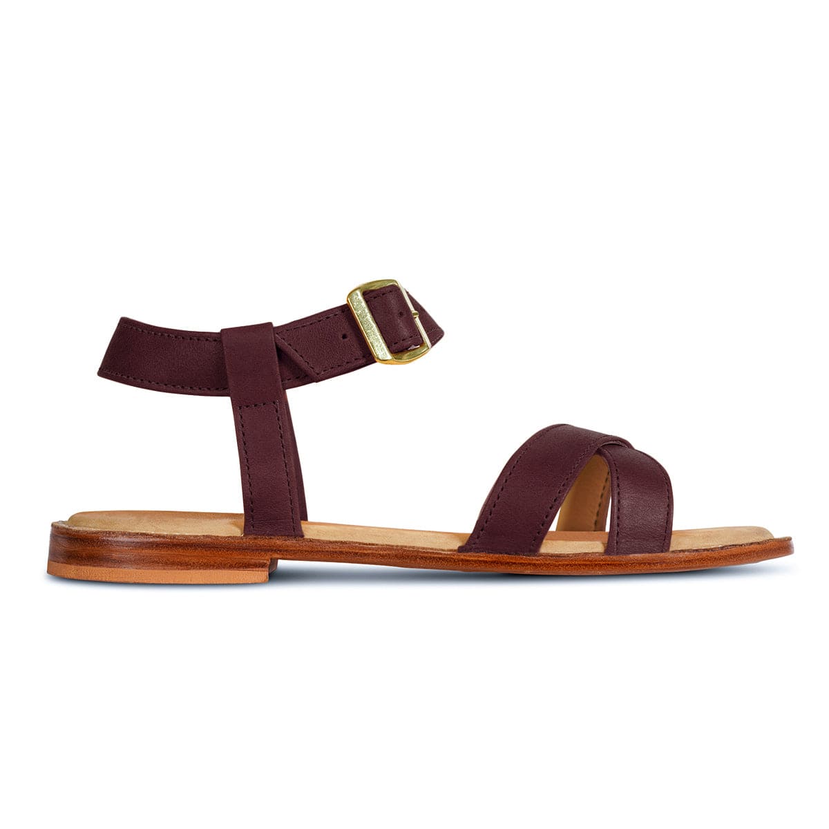 Women's burgundy leather sandal with adjustable ankle strap and brass buckle, handcrafted by Adelante