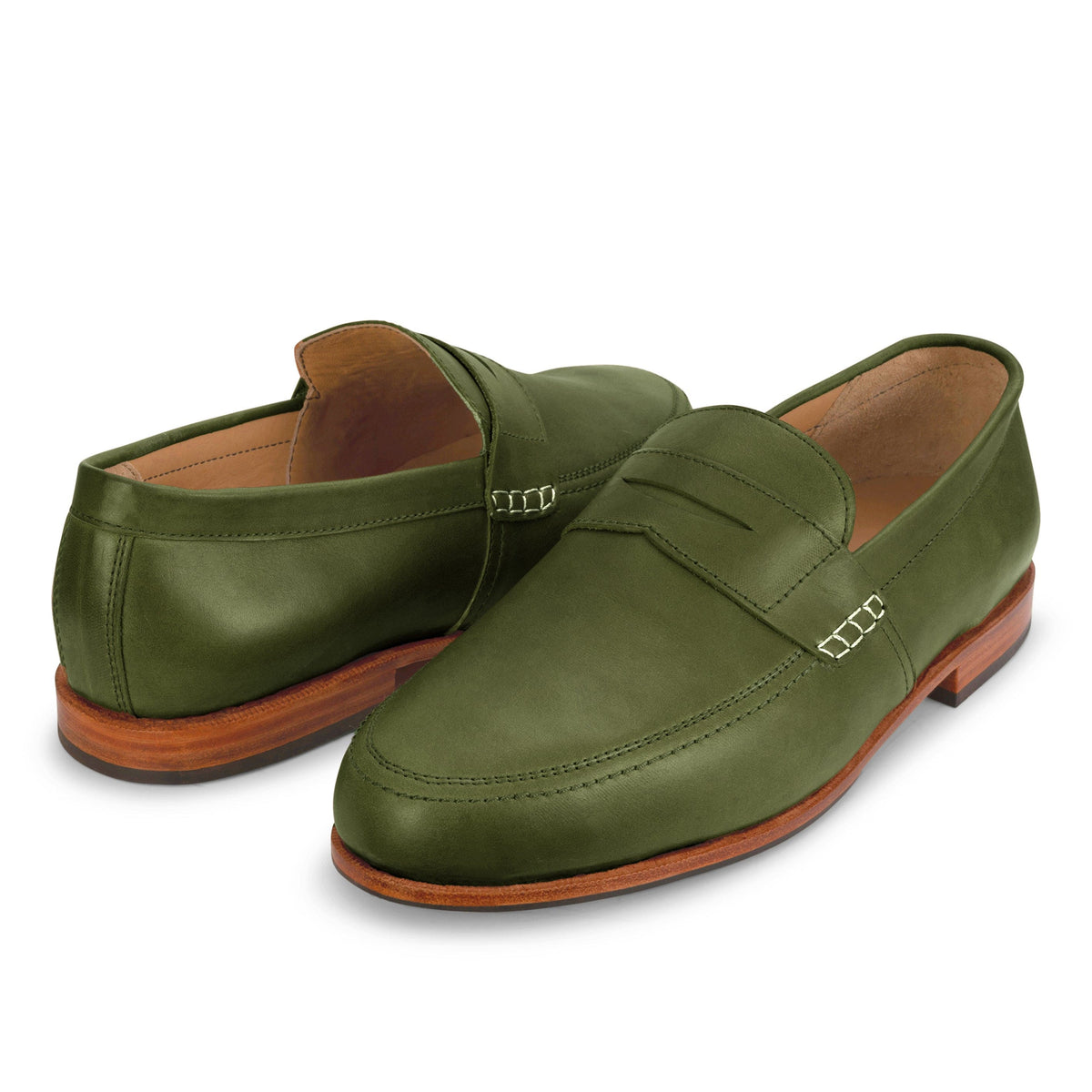 Handcrafted green leather men's dress loafers with moc toe stitching, metal side accents, and wood toned soles