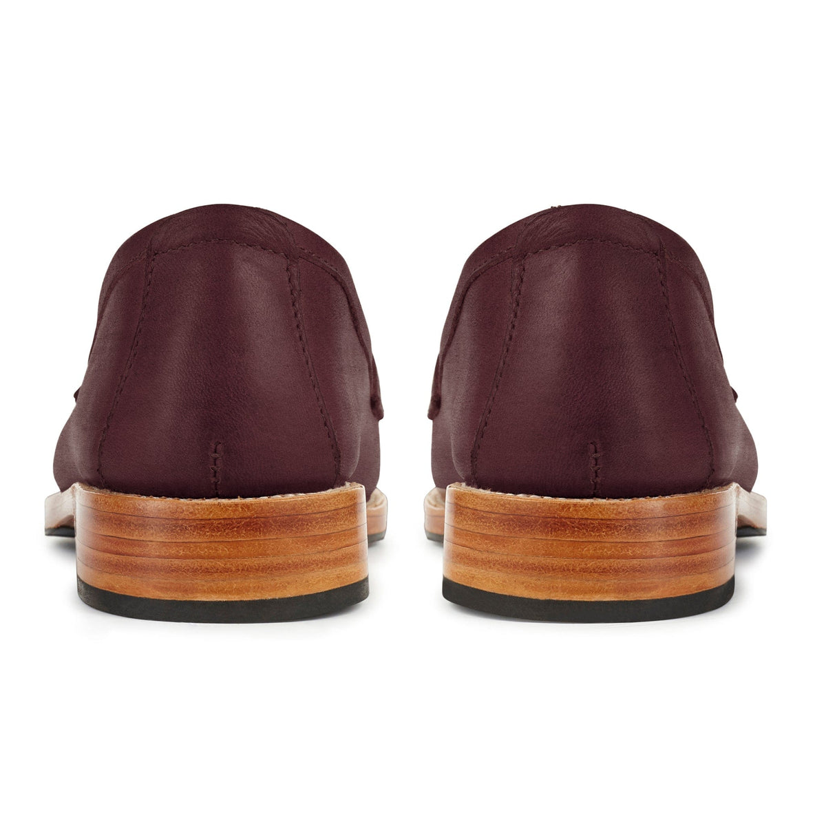 Burgundy leather womens penny loafers with handcrafted stitching and stacked wood heels shown from the back by Adelante Made To Order