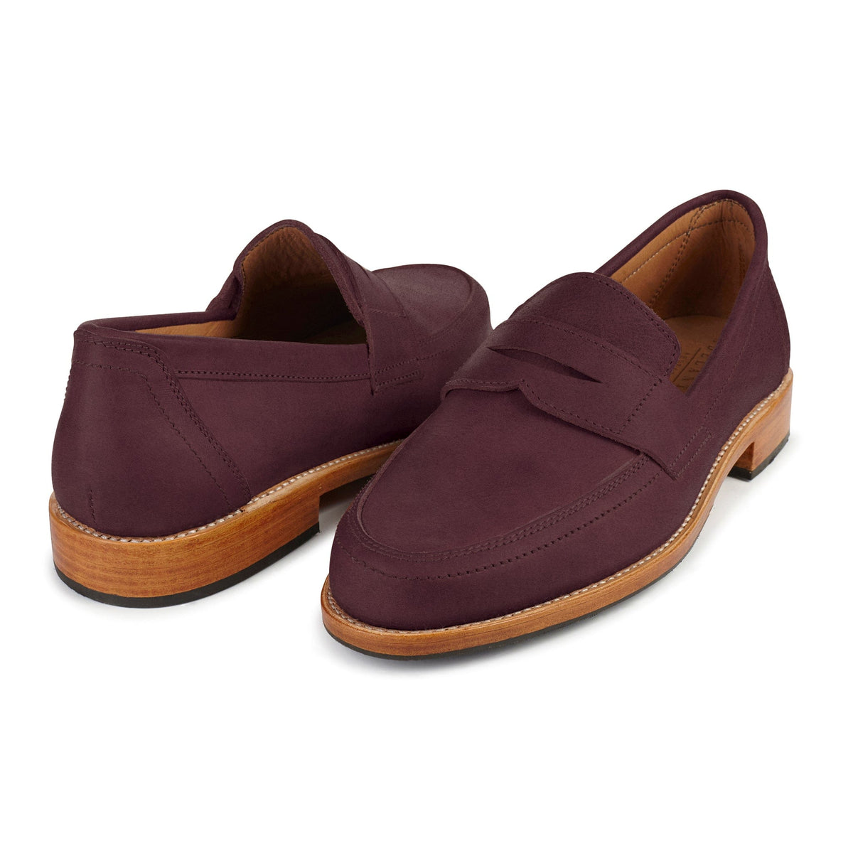 Burgundy men's penny loafers with classic penny bridges and wood tone soles, handcrafted by Adelante and available in extended sizes and wide widths