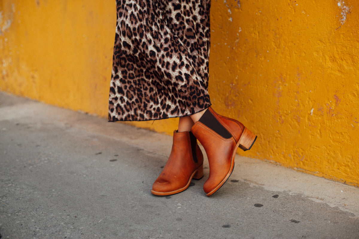 Women's narrow A-width light brown leather heeled Chelsea boots, worn on foot, made to your exact length and width