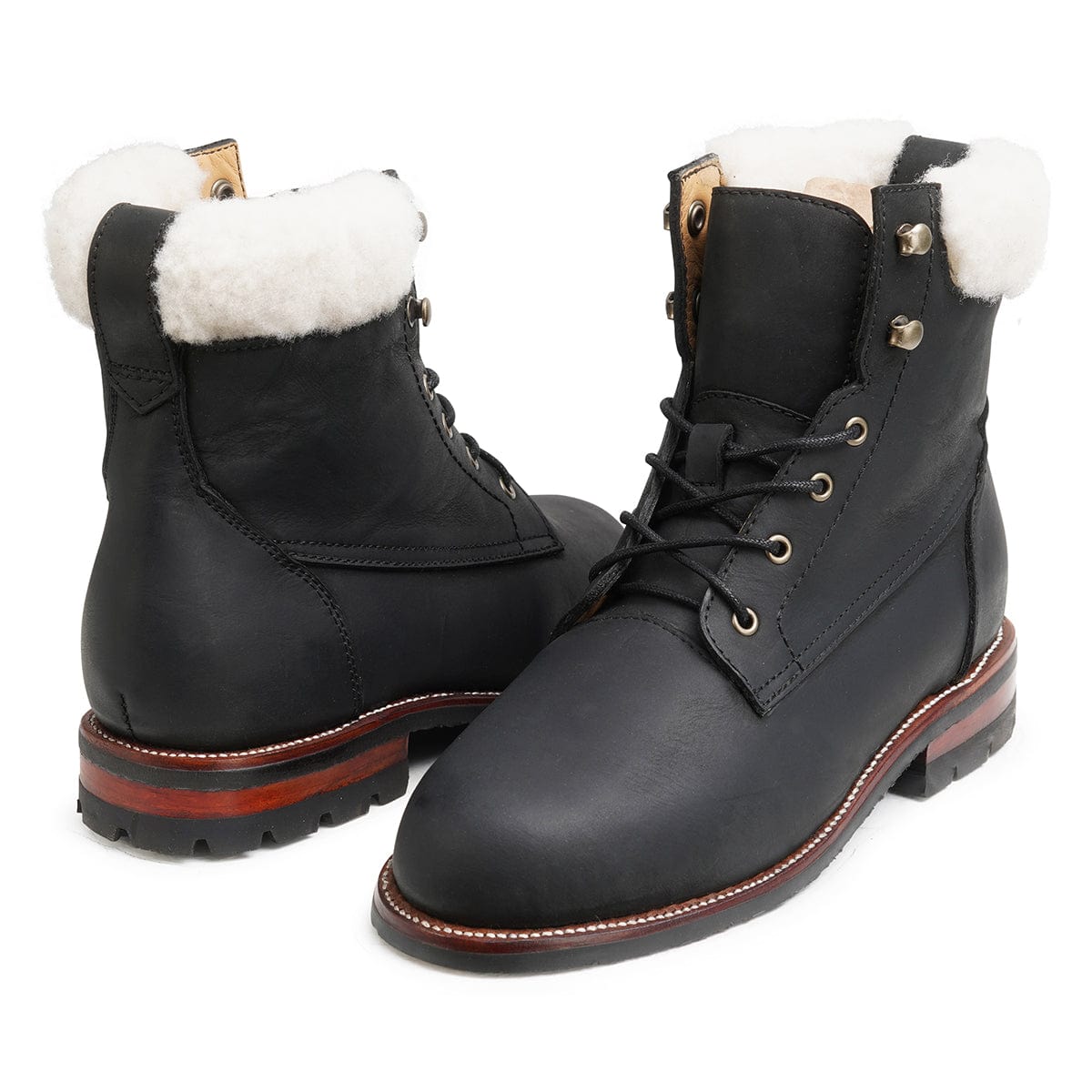 Pair of women's narrow A-width shearling-lined black leather winter boots, angled from the front, made to order for hard-to-fit feet