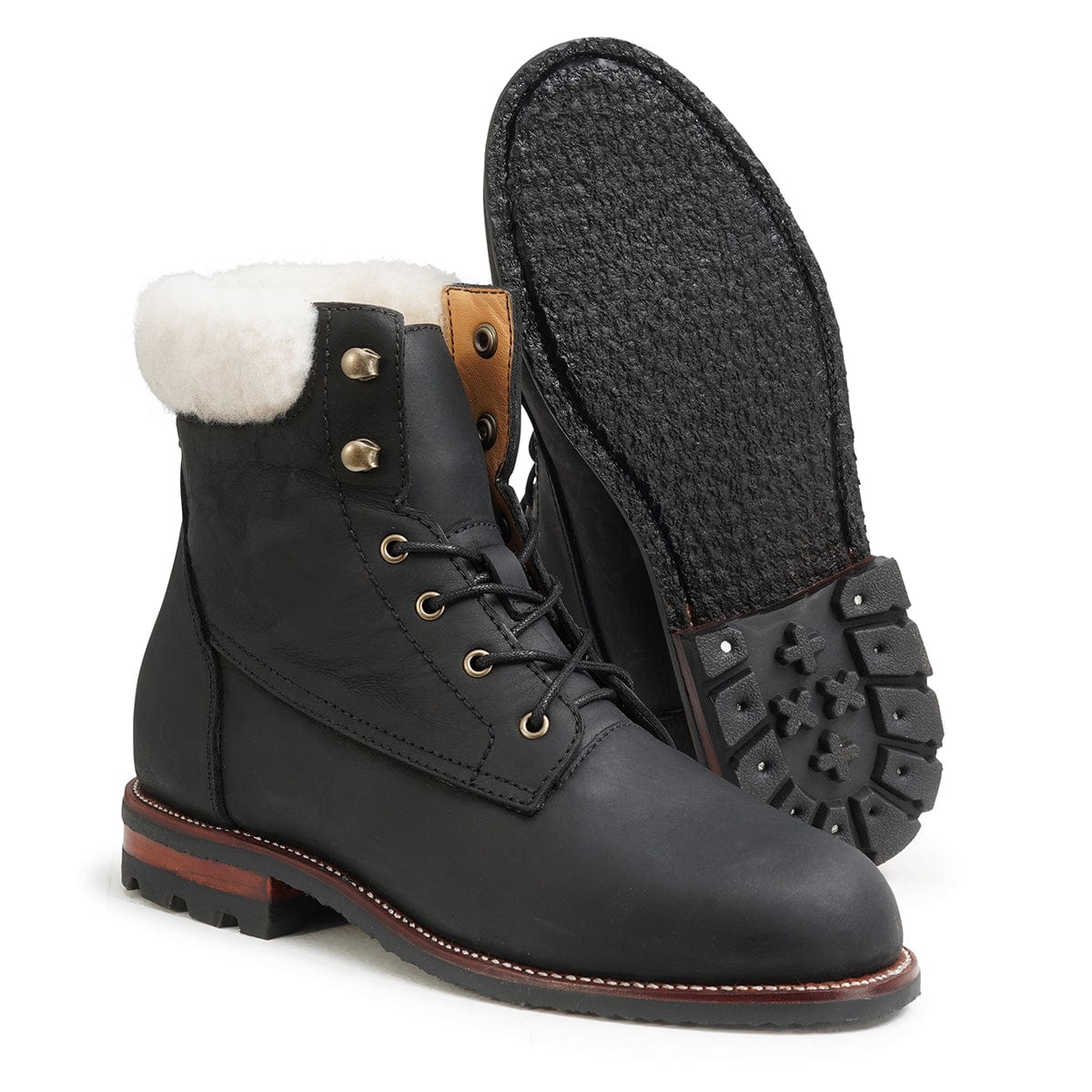 Women's EEE wide shearling-lined black leather winter boot, showing the leather sole. Crafted for wide and narrow feet