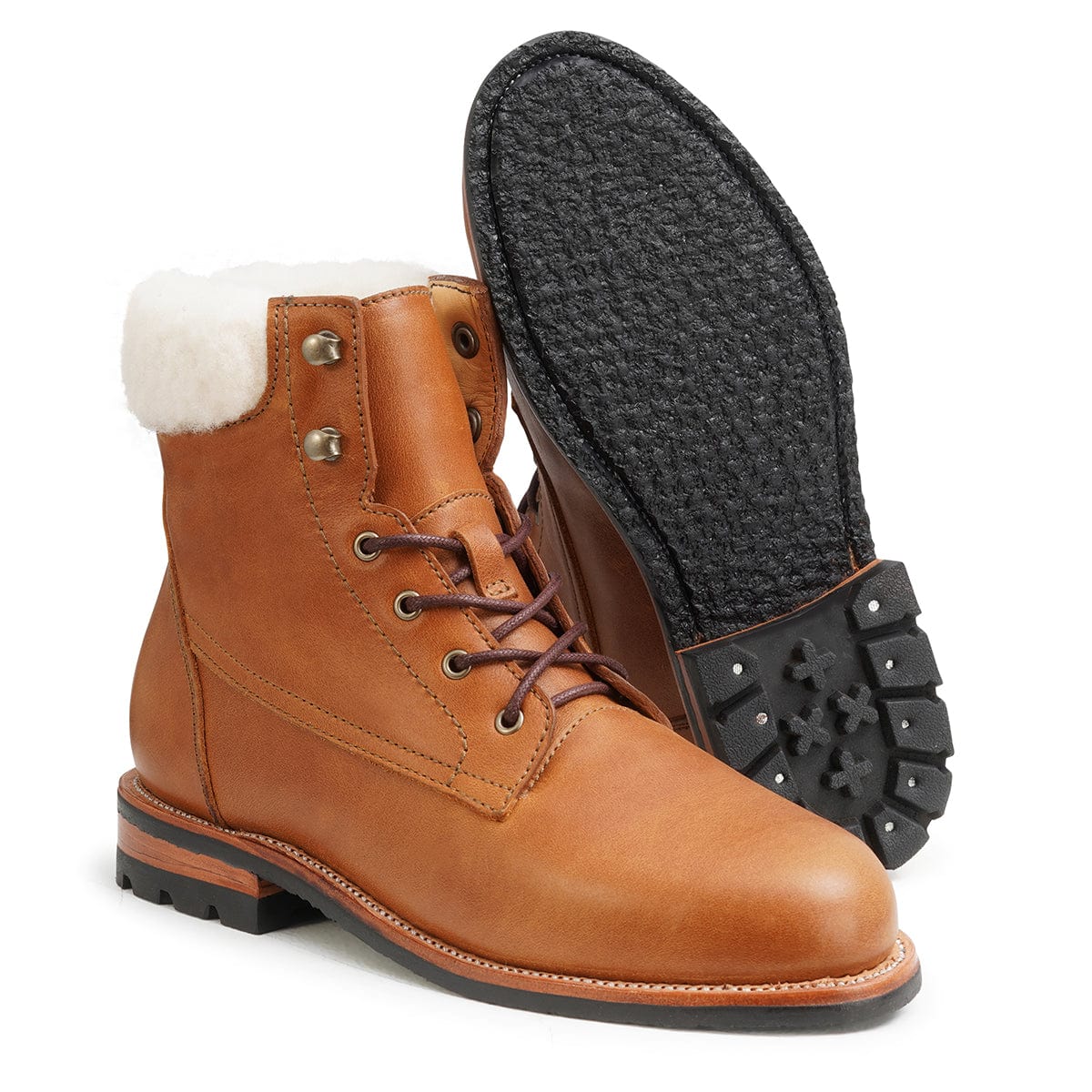 Women's EEE wide shearling-lined light brown leather winter boot, shown with the sole turned up, made to order in size 12