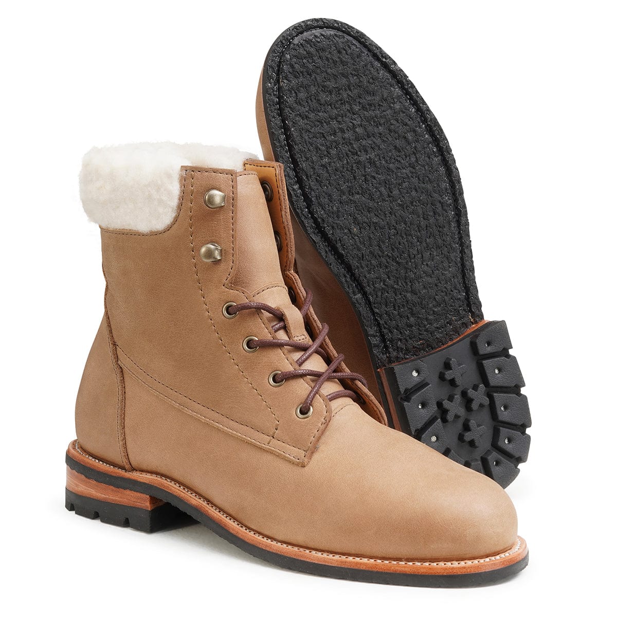 Women's 2E-wide shearling-lined tan leather winter boot, showing the leather sole, made to your exact length and width