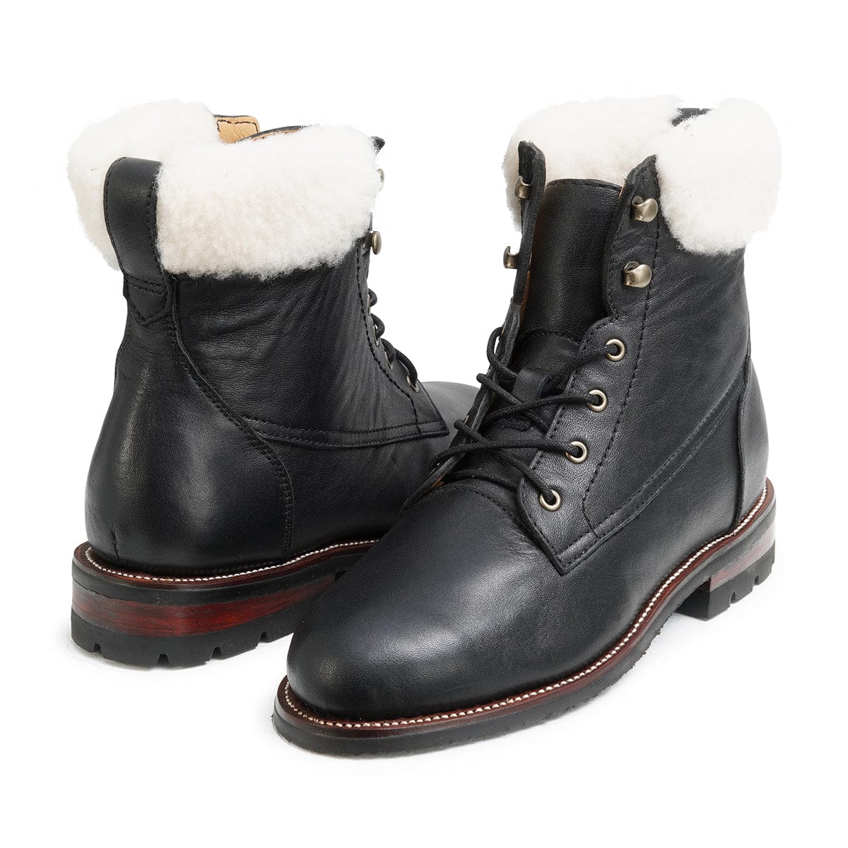 Women's wide shearling-lined black leather winter boots, shown at an angle, handcrafted to fit size 12