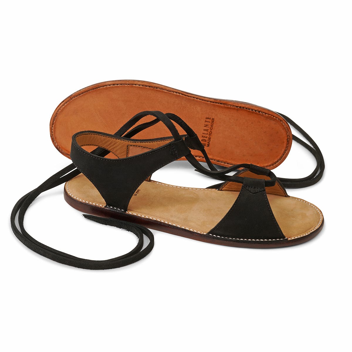 Black women's gladiator sandals with wraparound lace up straps and tan footbeds by Adelante Made To Order