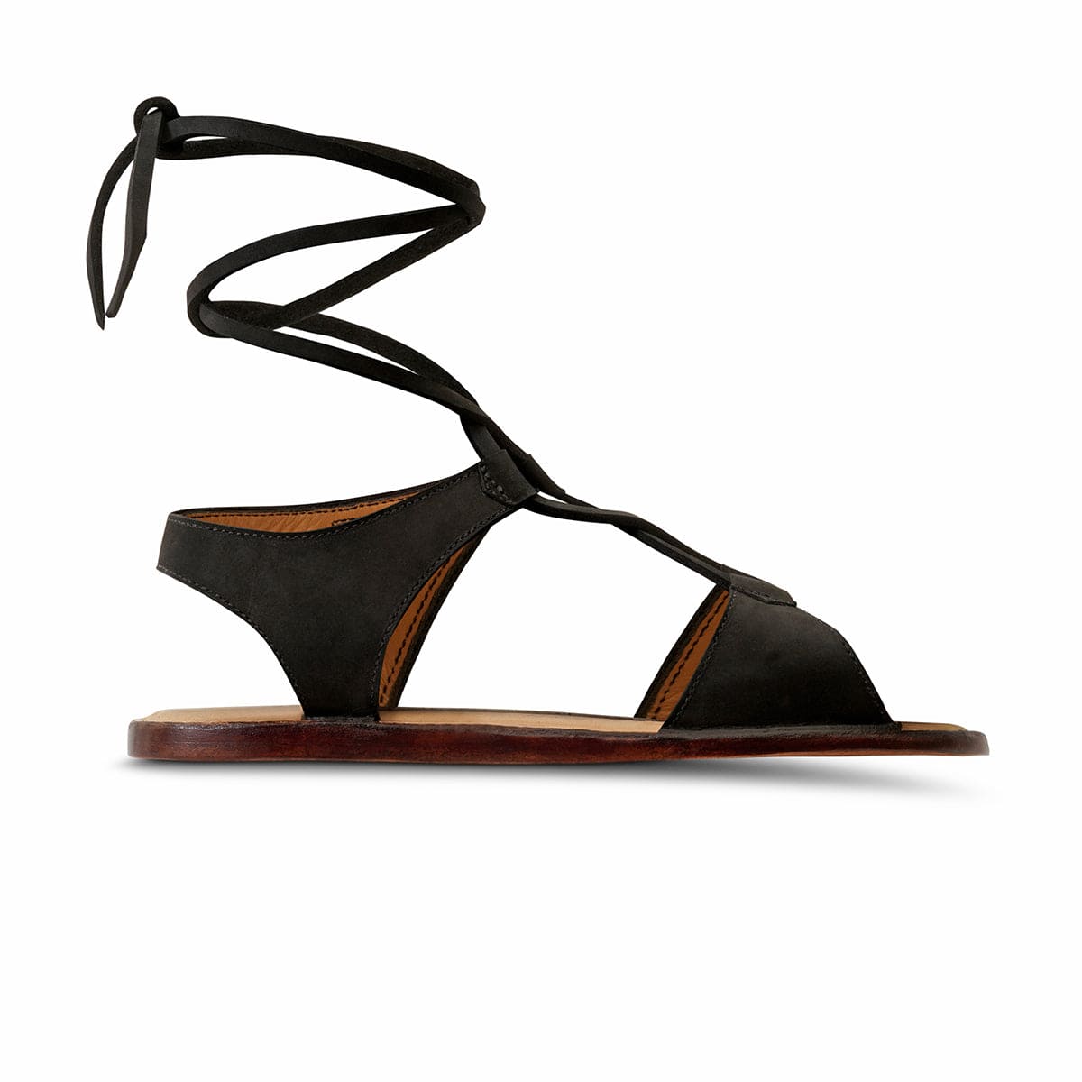 Black women's gladiator sandal with wraparound ankle laces and cutout straps, handcrafted and made to order by Adelante Made-To-Order