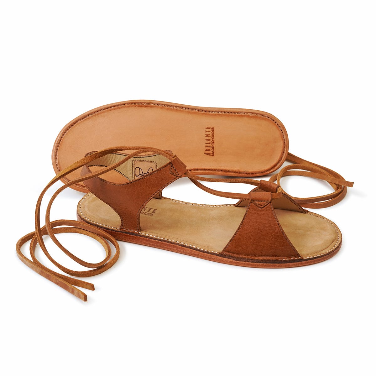 Brown leather women's gladiator sandal with wraparound laces, handcrafted by Adelante for wide widths