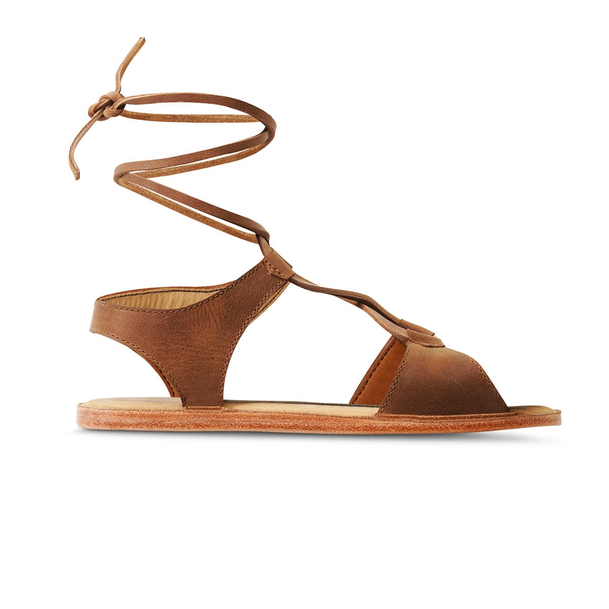 Adelante women's brown gladiator sandal with wraparound ankle laces and flat sole, available in wide widths