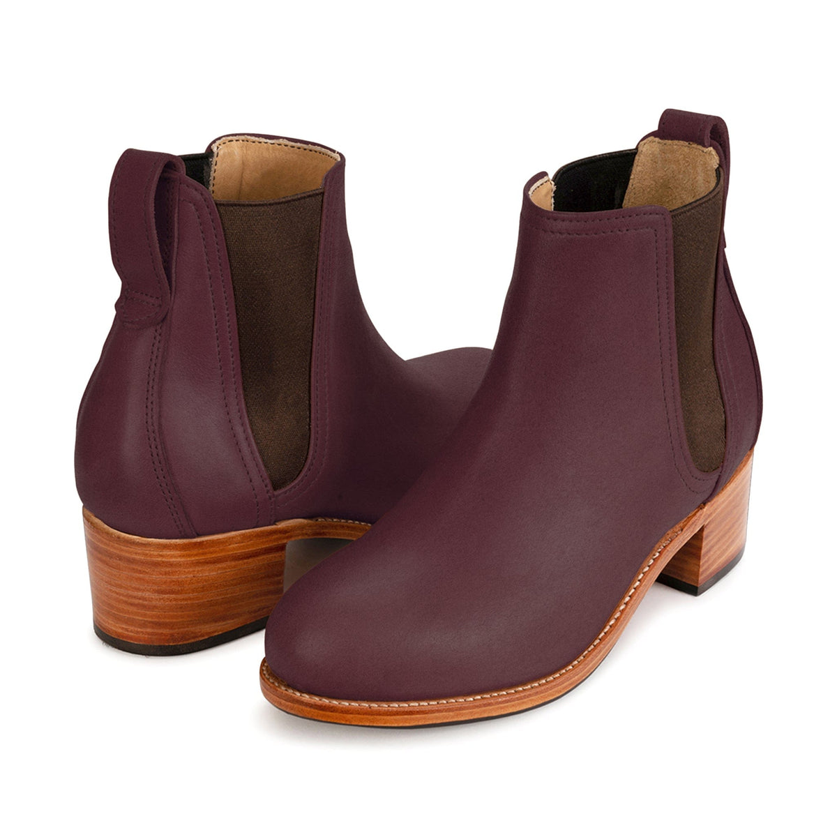 Pair of women's EEE wide purple leather heeled Chelsea boots, shown from the front at an angle, made to order for hard-to-fit feet