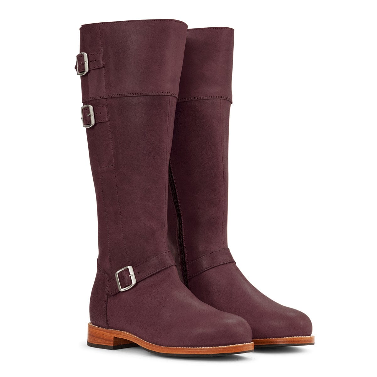 Burgundy women's knee-high riding boots with wraparound leather straps and buckle details, handcrafted by Adelante for custom calf widths