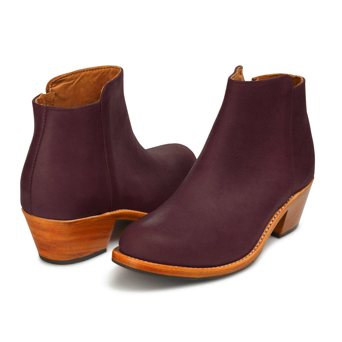 Burgundy leather women's ankle boots with pointed toes and tapered wood heels, available in narrow to extra wide widths