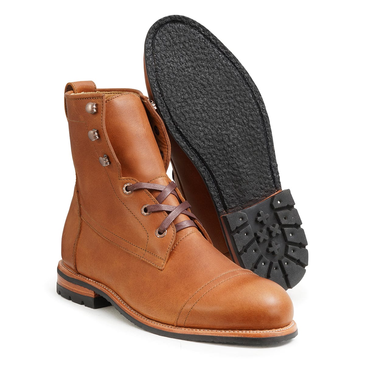 Men's extra-wide light brown leather lug sole boot, with the sole turned up, also made for size 4.5 feet