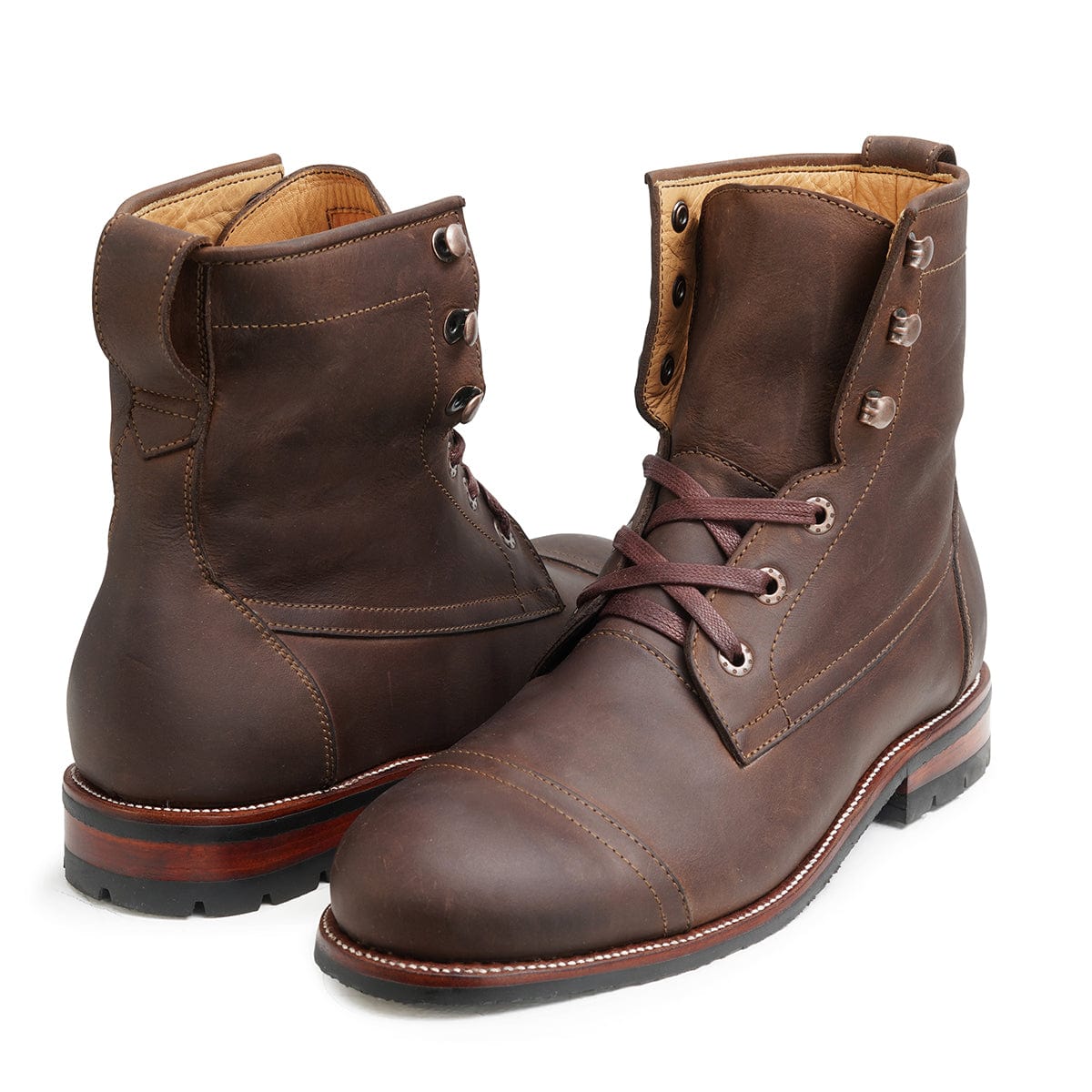 Pair of men's EEEEE extra-wide dark brown leather lug sole boots, shown from the front at an angle, made to your exact length and width