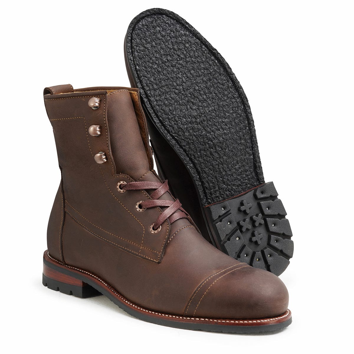Men's 2E-wide dark brown leather lug sole boot, shown with the sole turned up, handcrafted to fit size 16.5