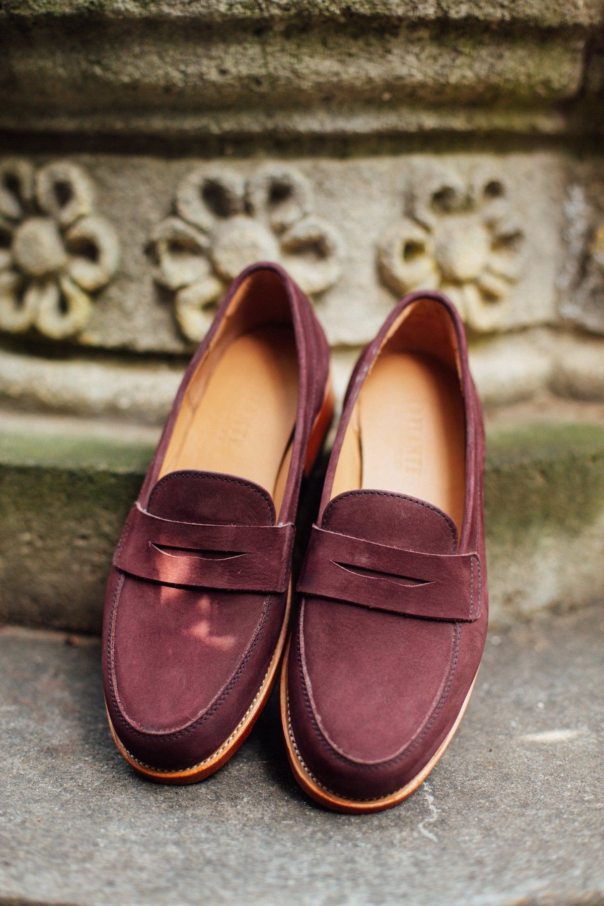 Burgundy leather women's penny loafers with classic penny bridges and cushioned insoles, handcrafted by Adelante Shoes