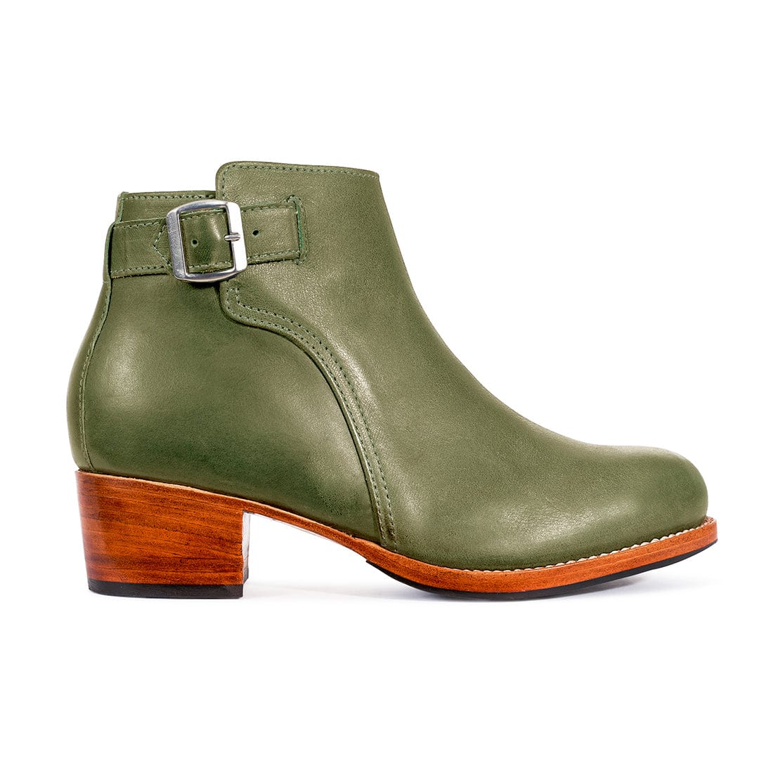 Olive green womens buckle bootie with adjustable strap, stacked block heel, and handcrafted detailing by Adelante