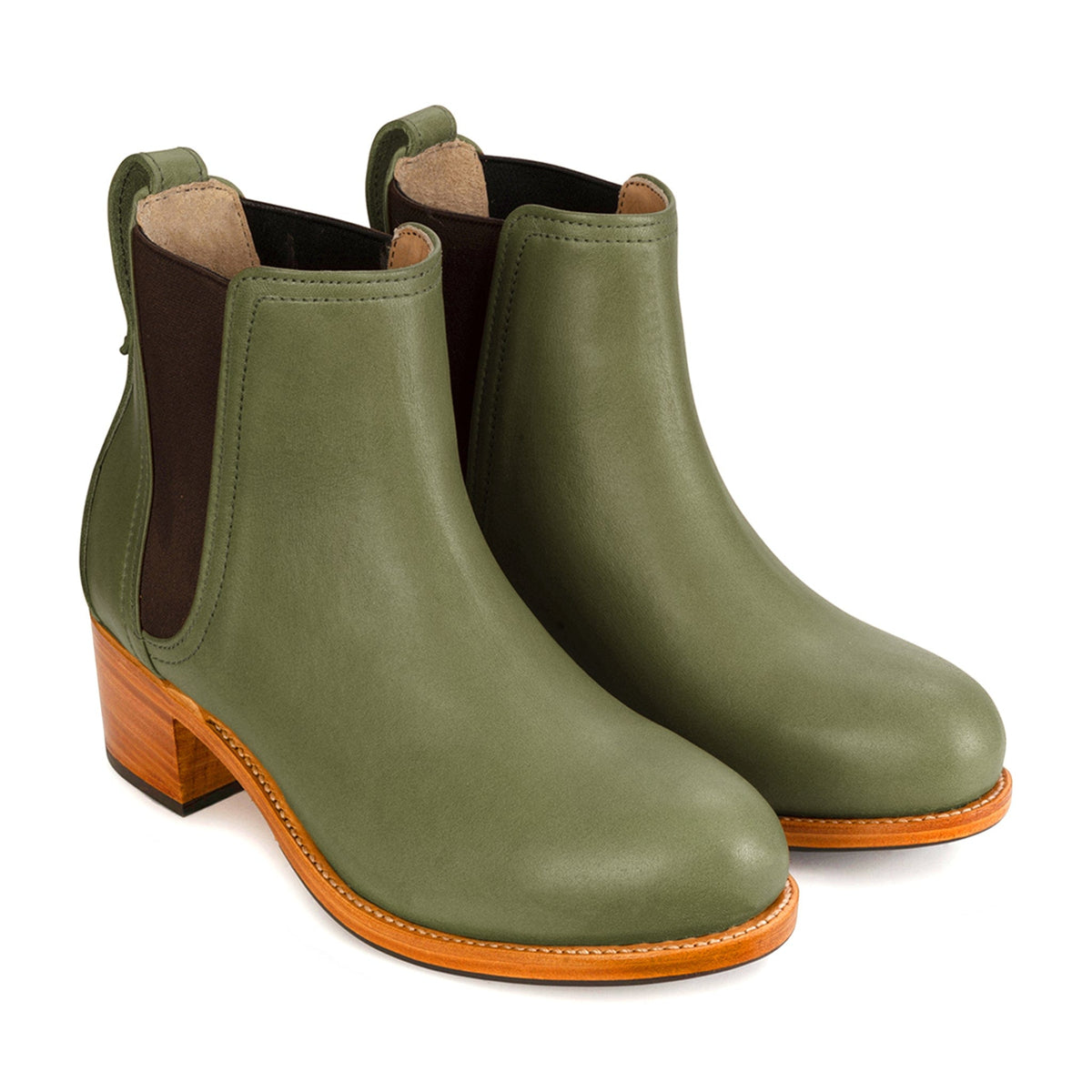 Women's 3E-wide green leather heeled Chelsea boots, shown from the front at an angle. Crafted for wide and narrow feet – The Catalina