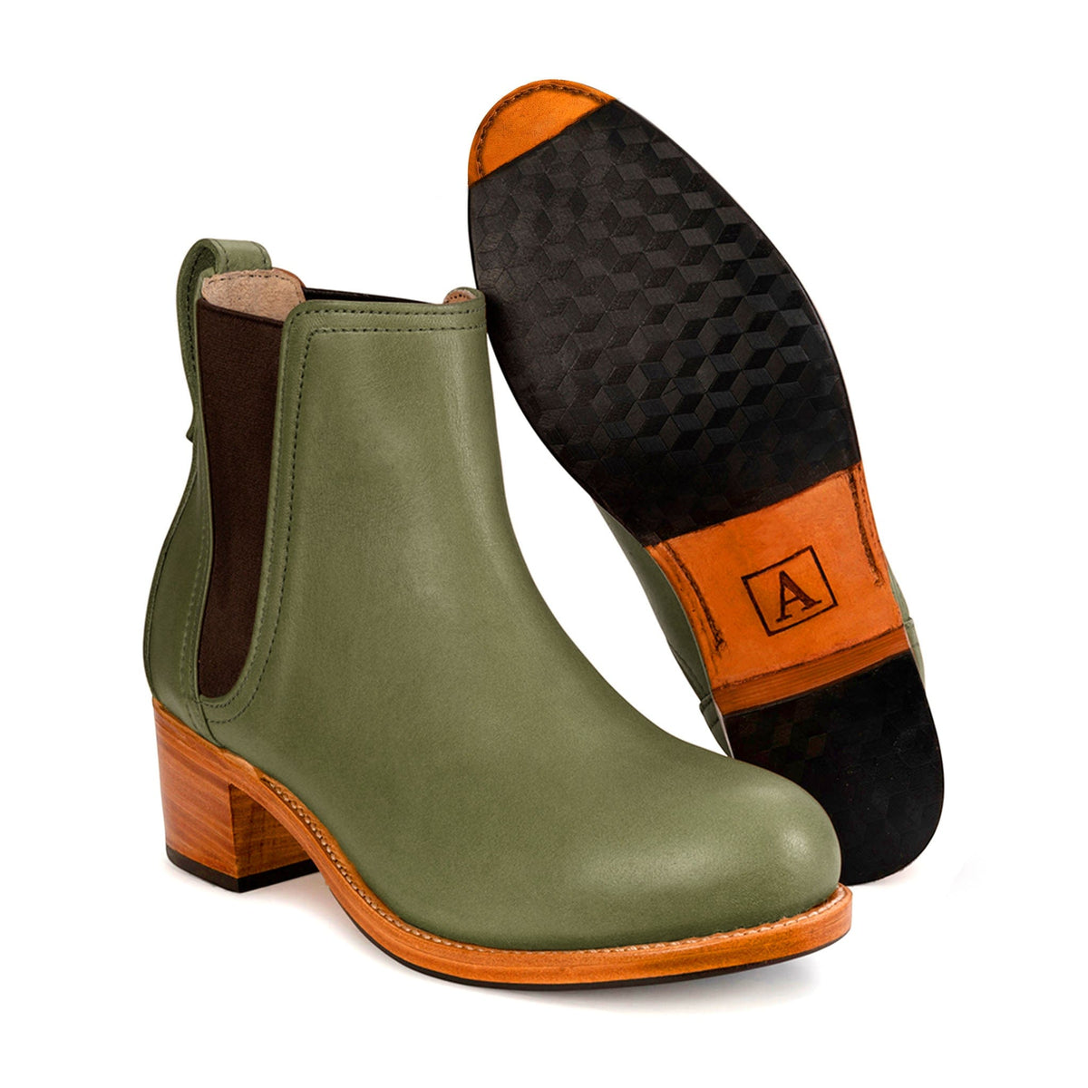 Women's 3E-wide green leather heeled Chelsea boot, showing the leather sole, with split sizing for two different-sized feet