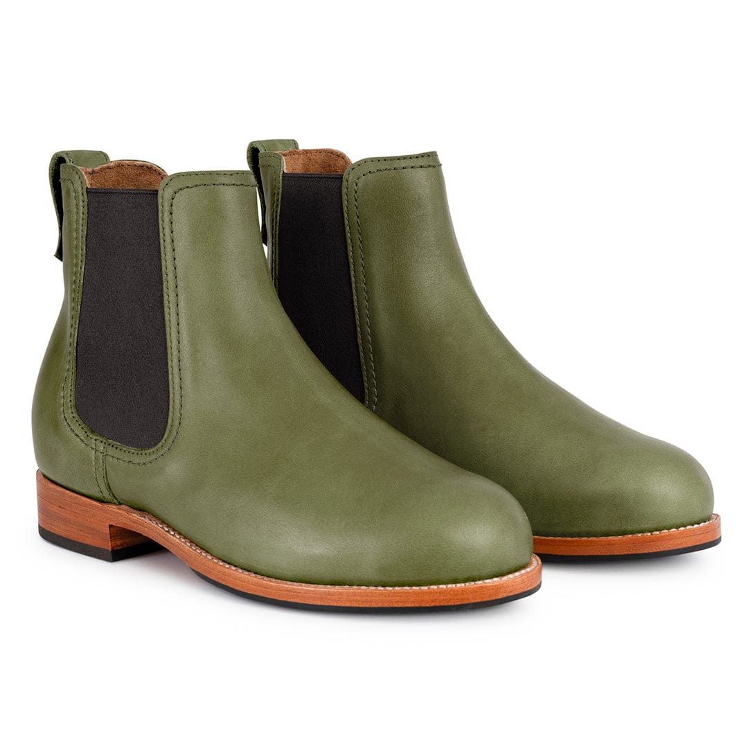 Olive green women's Chelsea boots with black elastic side panels, contrast stitching, pull tabs, and stacked brown heels, available in wide widths by Adelante.