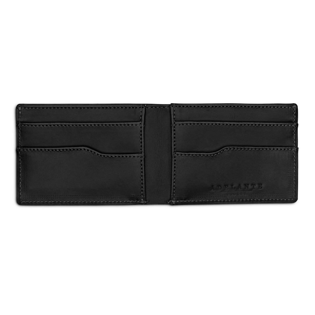 Black leather bi-fold wallet, open to show the card slots, full-grain leather, made by hand