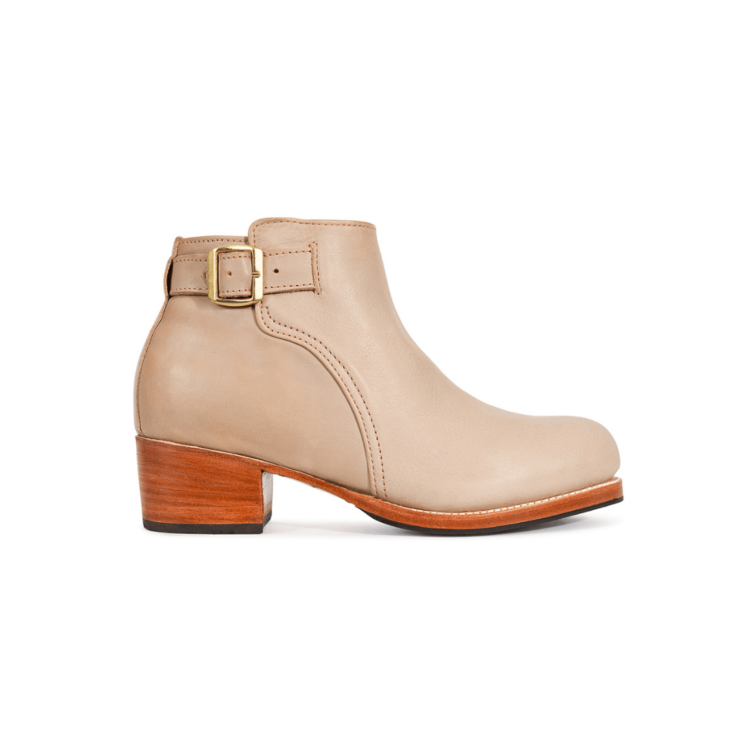 Beige women's buckle bootie with a block heel and stitched detailing from Adelante Shoes