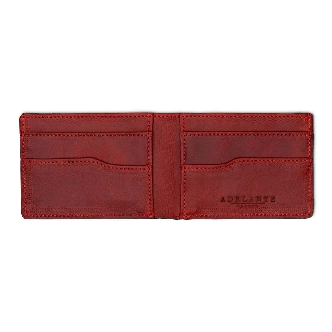 Red leather bi-fold wallet, open to show the card slots, full-grain leather, made by hand