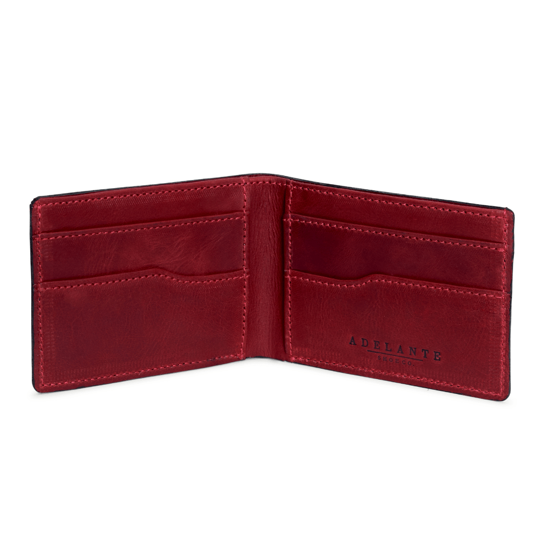 Red leather bi-fold wallet, open to show the card slots