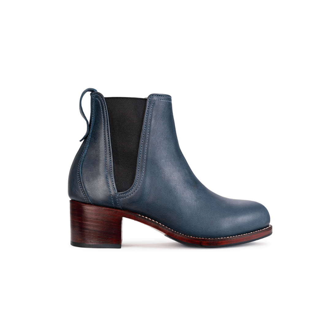 Women's wide blue leather heeled Chelsea boot, seen from the side, with split sizing for two different-sized feet