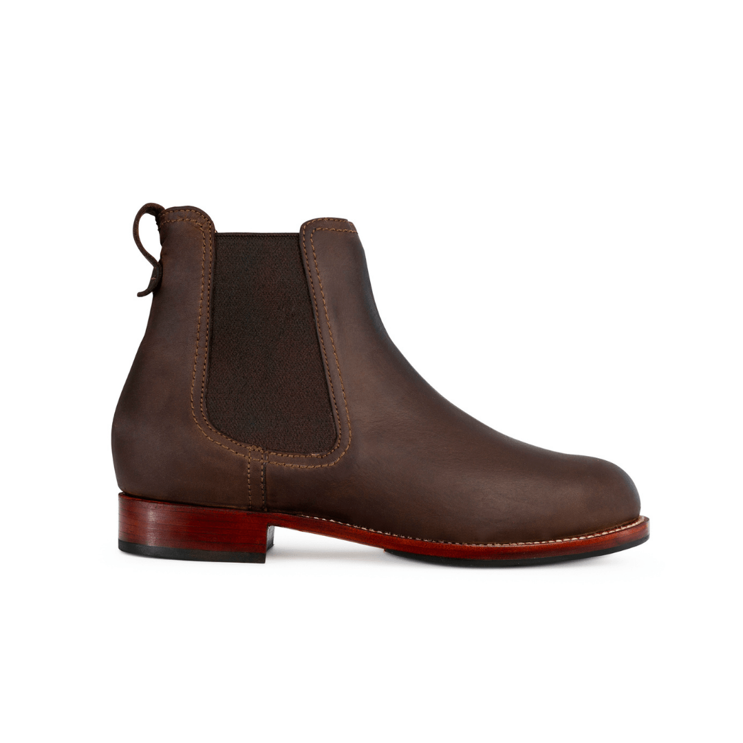 Handcrafted brown women's Chelsea boot with elastic side panels, pull tab, contrast stitching, and a low walking heel