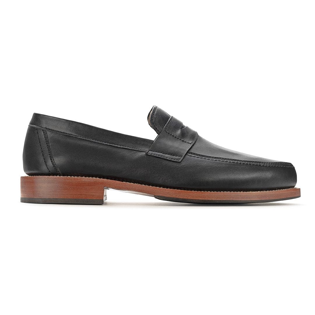 Black men's penny loafer with classic penny bridge, sleek toe, and stacked wood heel, available in wide widths