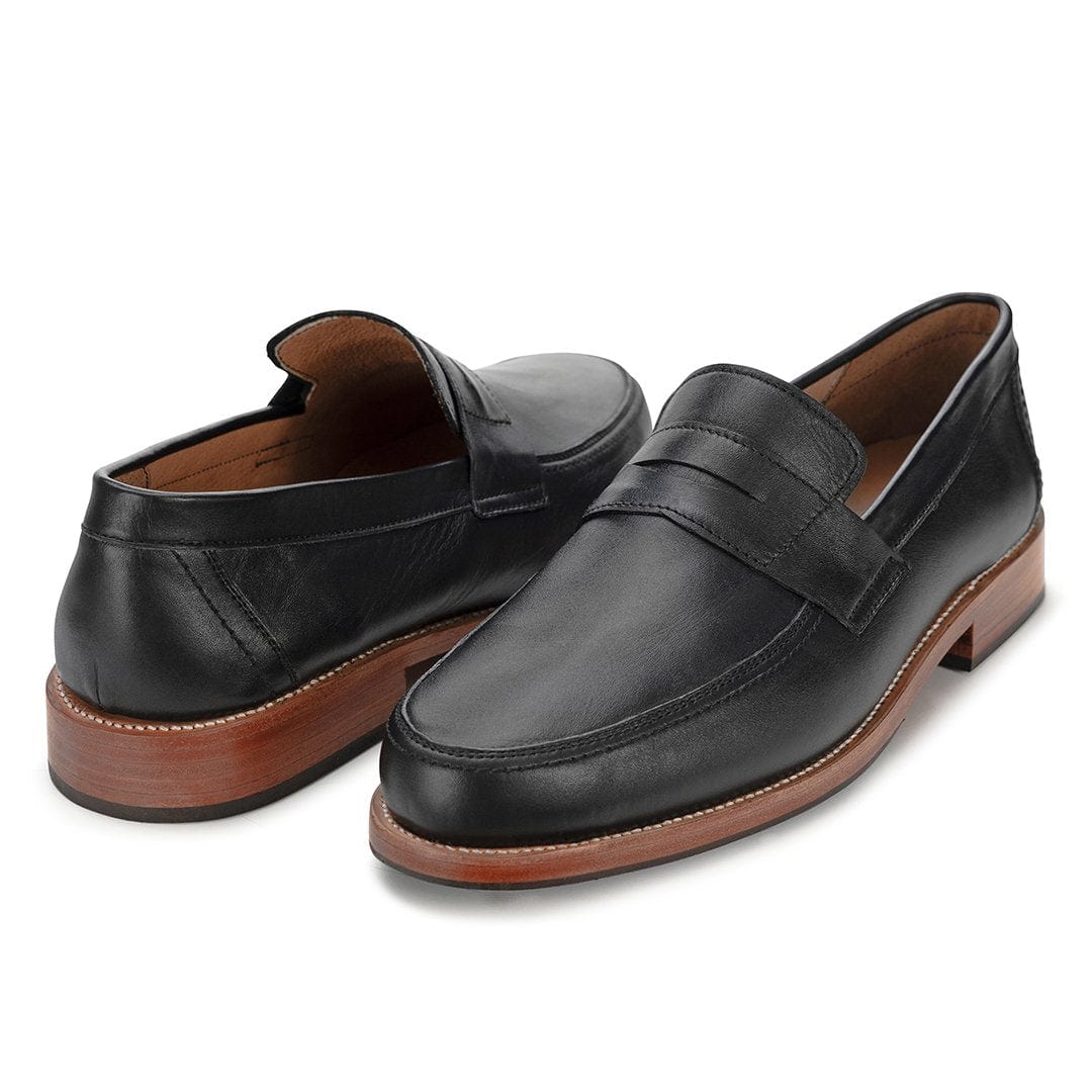 Men's EEEEE extra-wide black leather penny loafers, shown at an angle, a size 5 is no problem – The Luca