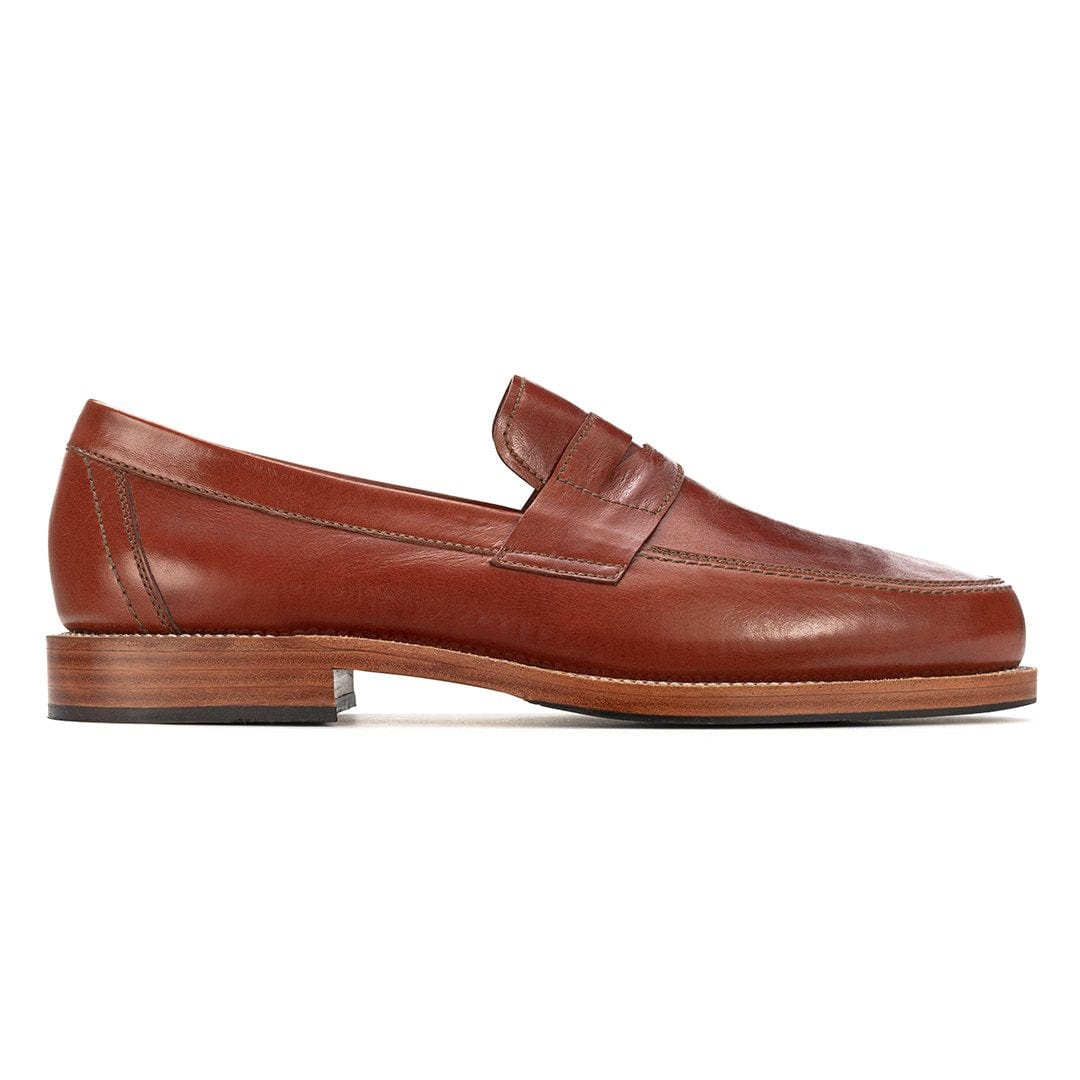 Brown men's penny loafer with a classic penny bridge and sleek toe, handcrafted by Adelante Shoes in wide widths