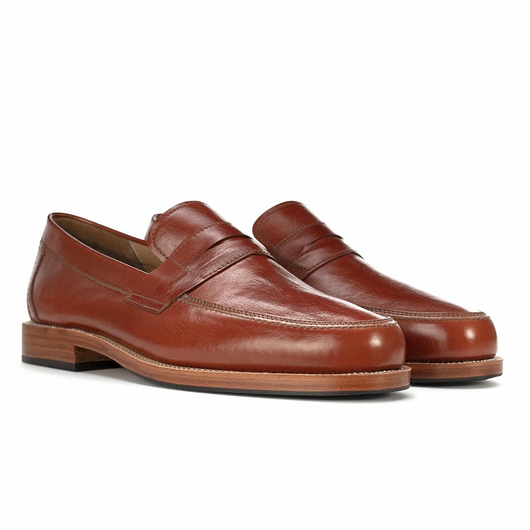 Men's 4E-wide brown leather penny loafers, shown at an angle, also made for size 10.5 feet – The Luca