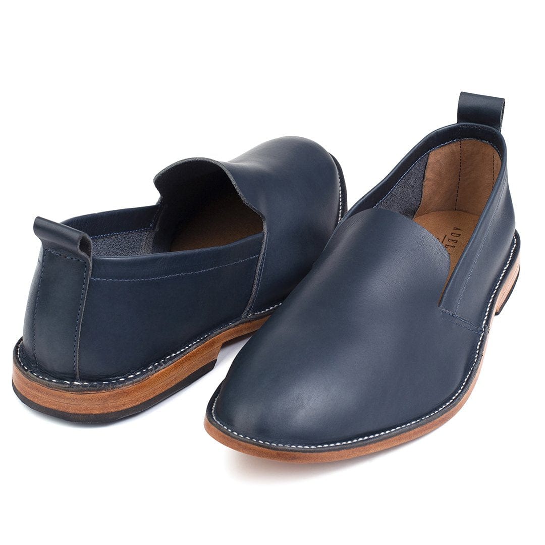 Men's EEEEE extra-wide blue leather slip-ons, shown at an angle, handcrafted to fit size 4.5 – The Viento