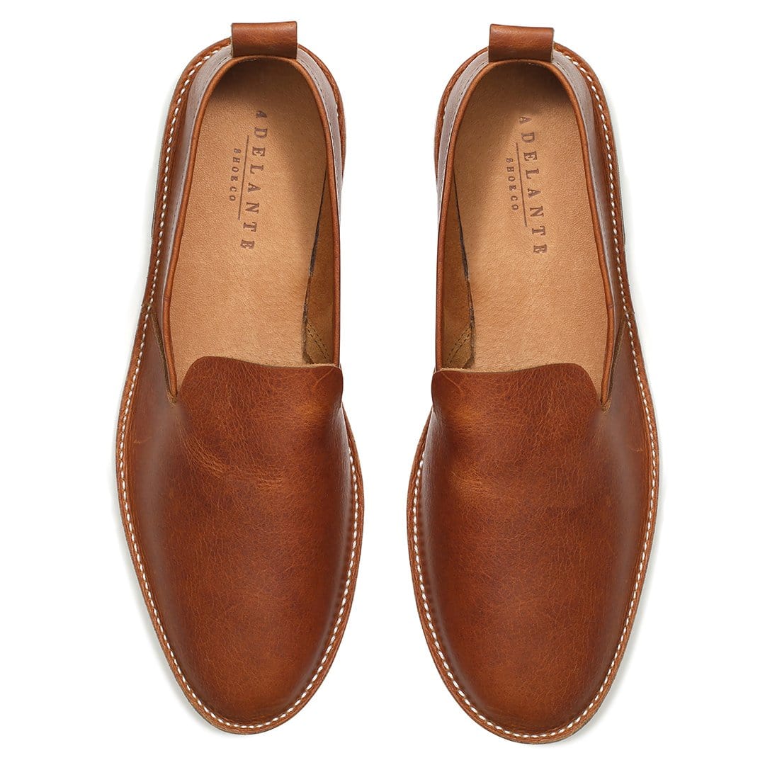 Men's wide light brown leather slip-ons, seen from above. Handcrafted to order in Guatemala – The Viento