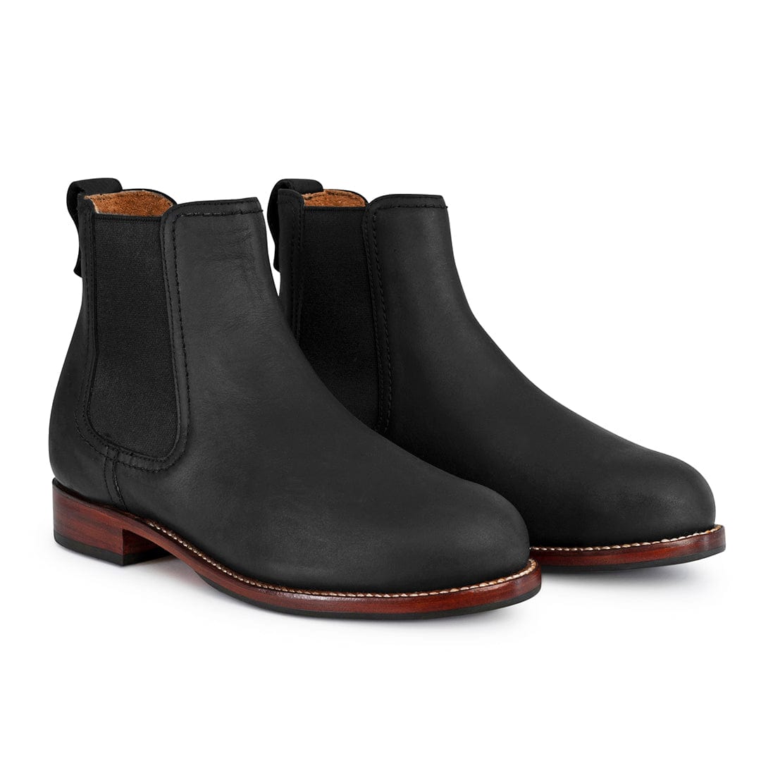 Black women's Chelsea boots with elastic side panels, pull tabs, contrast stitching, and brown stacked heels by Adelante Made-To-Order
