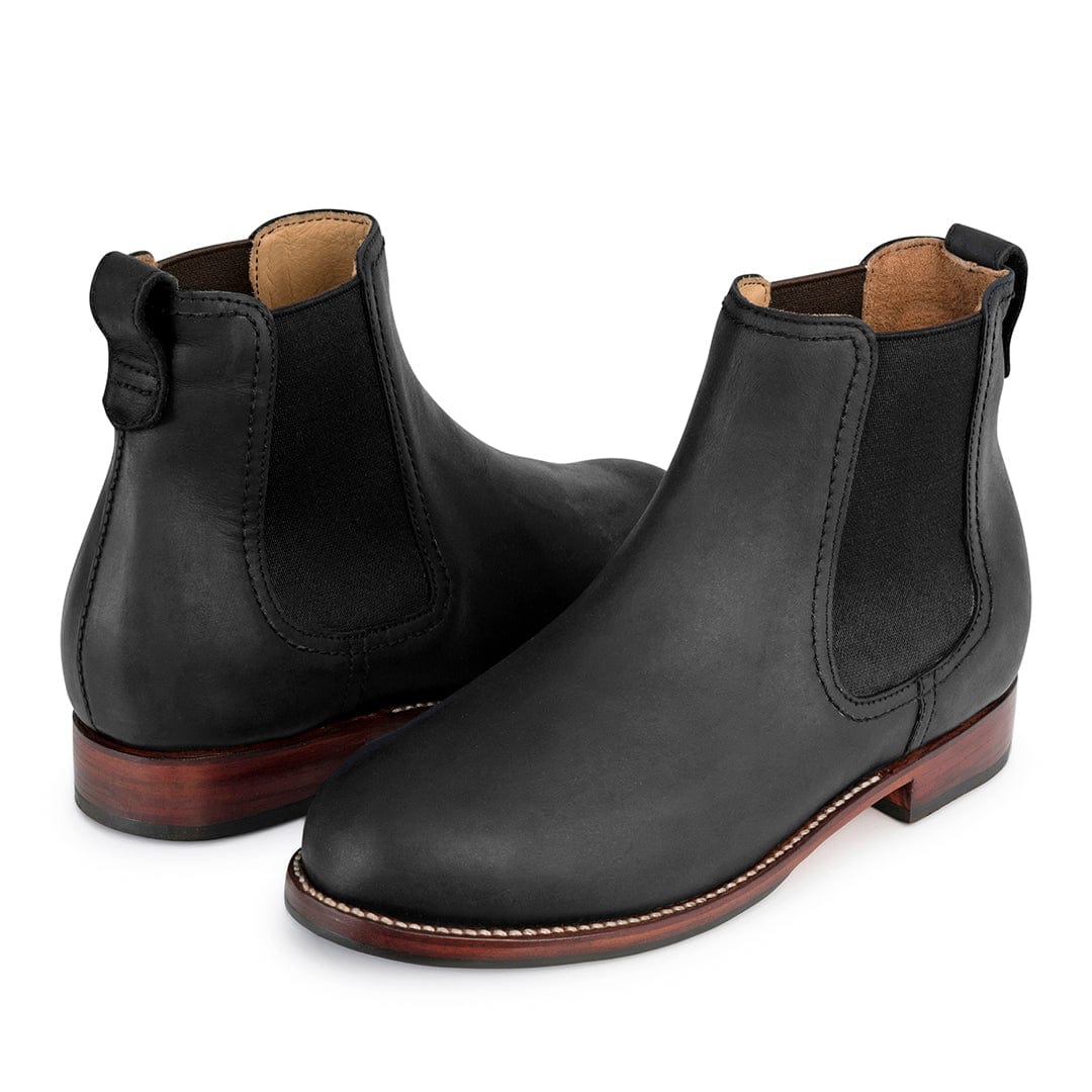Black women's Chelsea boots with contrast stitching, elastic side panels, pull tabs, and low walking heels, available in wide widths