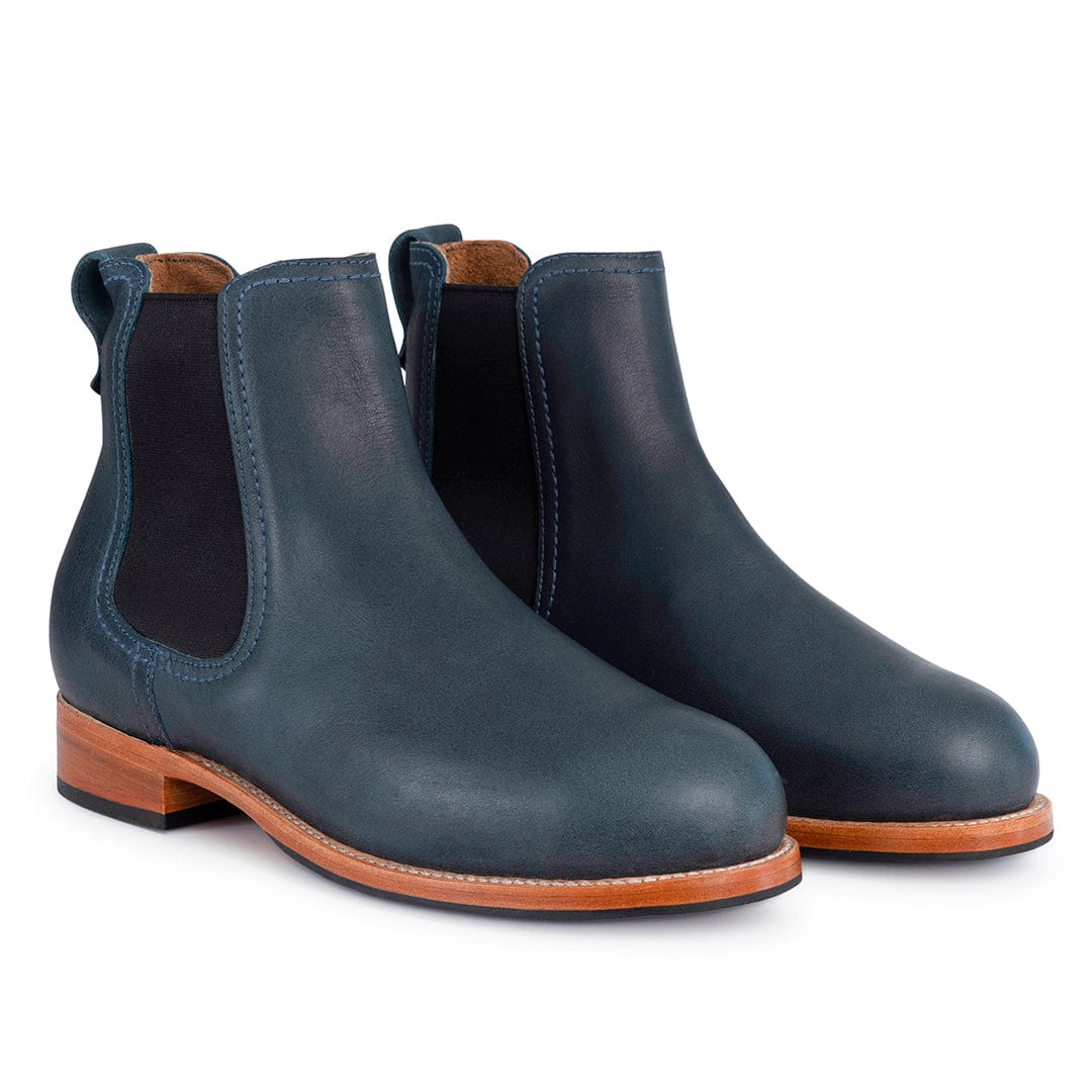 Women's dark navy Chelsea boots with elastic side panels, pull tabs, contrast stitching, and low walking heels, available in wide widths