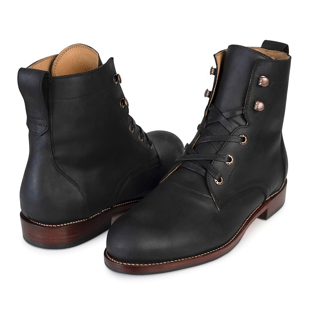 Black mens lace up boots in full grain leather with brass eyelets Goodyear welt construction and brown stacked heels